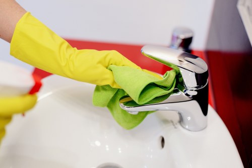 End of tenancy cleaner working in a Swisscottage kitchen